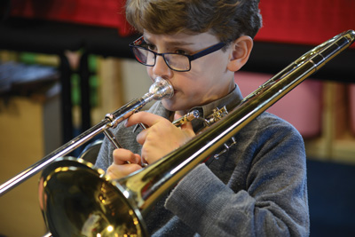 trombone playing boy