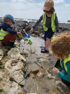 children-on-beach-foraging